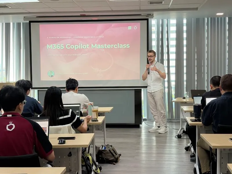Artur presenting at the front of the room during the Microsoft 365 Copilot masterclass