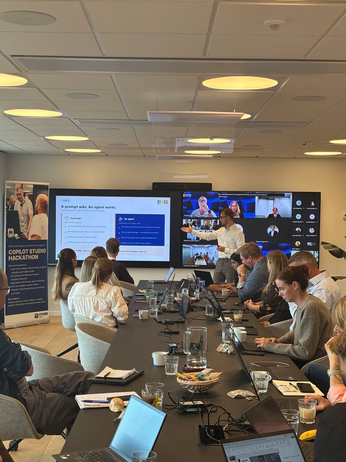 A full room of participants building agents on their laptops at the HR AI Hackathon